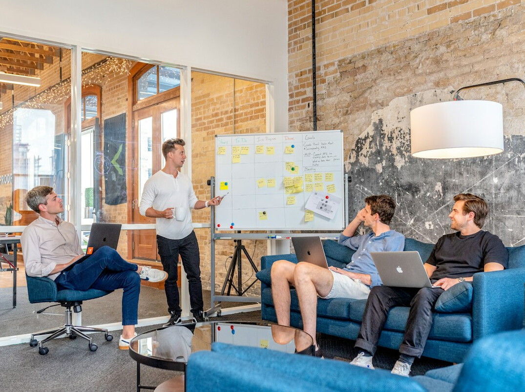 business manager leading team meeting