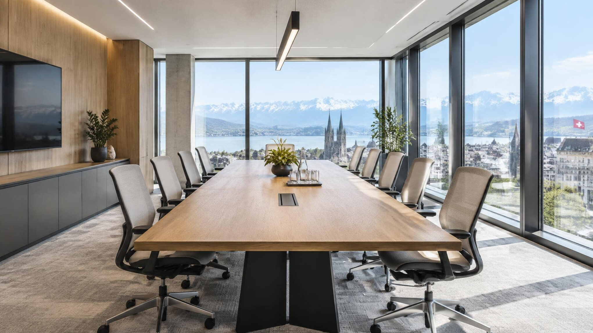 Empty modern conference room with large table and chairs